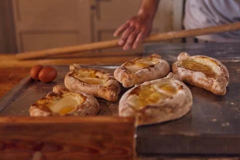 The process of preparing a dish of Caucasian cuisine khachapuri. . Stock Photos