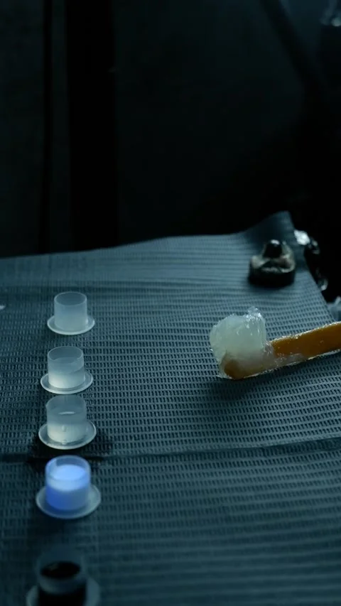 The process of preparing the equipment, the tattoo artist is emptying Vaseline.  Stock Footage 201543229