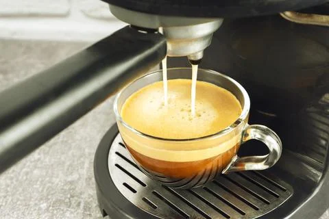 Process of preparing espresso with coffe machine. Stock Photos