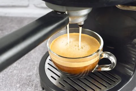 Process of preparing espresso with coffe machine. Stock Photos