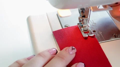 The process of preparing fabric parts for sewing on a sewing machine. Stock Footage 169989636