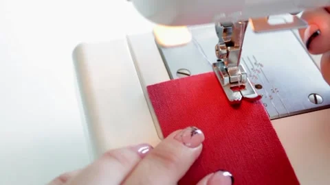 The process of preparing fabric parts for sewing on a sewing machine. Stock Footage 169989792