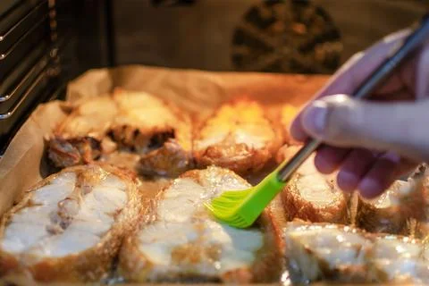The process of preparing fish at home. Homemade baked goods in the shape of fish Foto stock