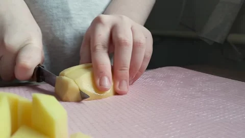 Process of preparing food with the child. Close-up. Child chef. Stock Footage 241175150