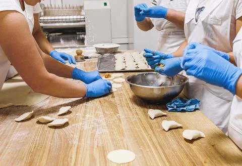 The process of preparing food from dough in the kitchen Stockfoto's
