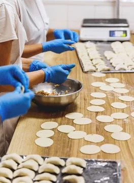 The process of preparing food from dough in the kitchen Stockfoto's