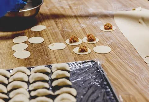 The process of preparing food from dough in the kitchen Stockfoto's