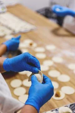 The process of preparing food from dough in the kitchen Stockfoto's