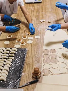 The process of preparing food from dough in the kitchen Stock Photos