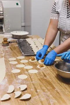 The process of preparing food from dough in the kitchen Stock Photos