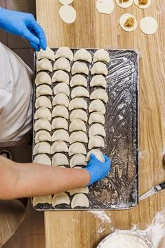 The process of preparing food from dough in the kitchen Stockfoto's