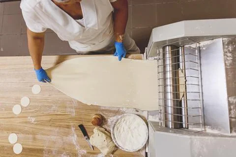 The process of preparing food from dough in the kitchen Stock Photos