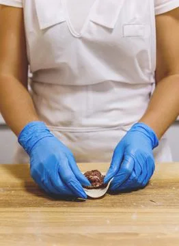 The process of preparing food from dough in the kitchen Stockfoto's