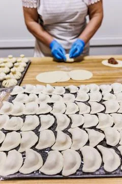 The process of preparing food from dough in the kitchen Stockfoto's