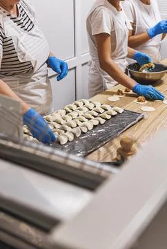 The process of preparing food from dough in the kitchen Stockfoto's