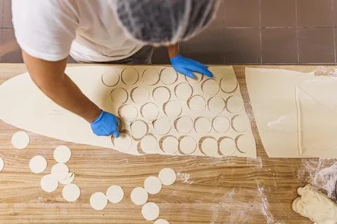 The process of preparing food from dough in the kitchen Stockfoto's