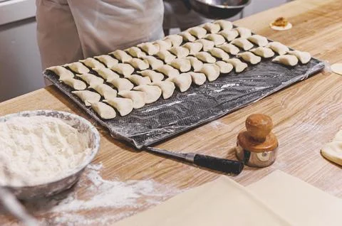 The process of preparing food from dough in the kitchen Stockfoto's