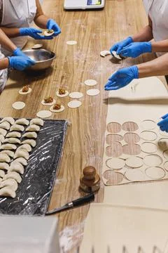 The process of preparing food from dough in the kitchen Stock Photos