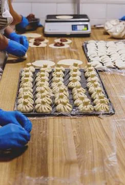 The process of preparing food from dough in the kitchen Stockfoto's