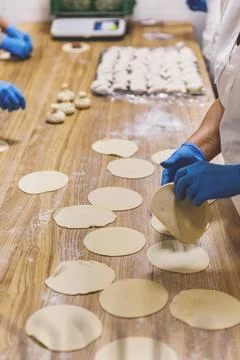 The process of preparing food from dough in the kitchen Stockfoto's