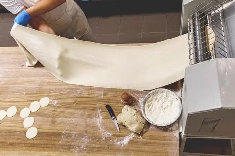 The process of preparing food from dough in the kitchen Stock Photos