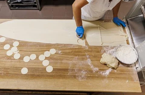 The process of preparing food from dough in the kitchen Stock Photos