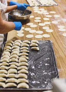 The process of preparing food from dough in the kitchen Stockfoto's