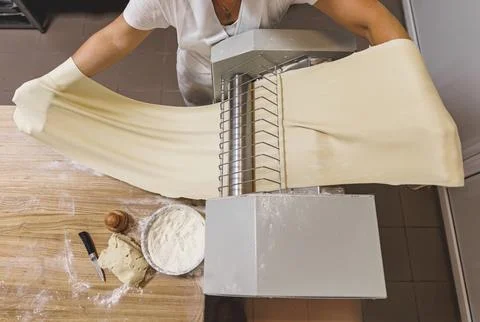 The process of preparing food from dough in the kitchen Stockfoto's