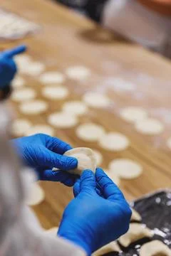 The process of preparing food from dough in the kitchen Stock Photos