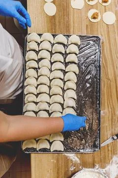 The process of preparing food from dough in the kitchen Stockfoto's