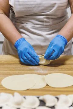 The process of preparing food from dough in the kitchen Stockfoto's
