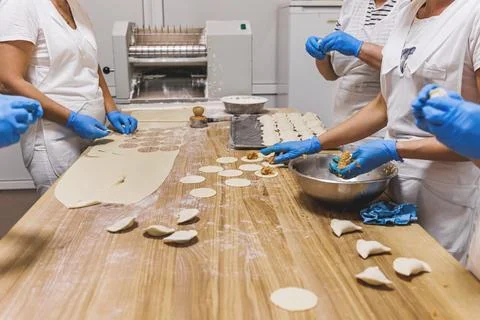 The process of preparing food from dough in the kitchen Stock Photos