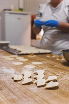 The process of preparing food from dough in the kitchen Stockfoto's