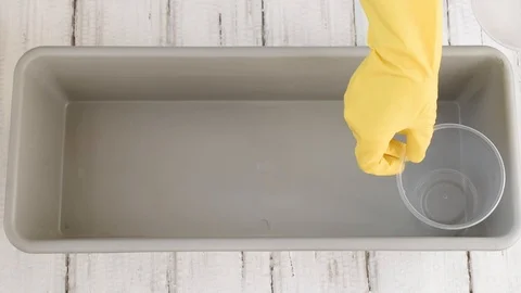 The process of preparing for growing seedlings. Plastic cups for earth and se Video stock 125195888