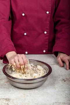 The process of preparing a homogeneous mass of dough for baking Photos