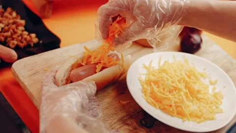 Process of preparing Irresistible chili cheese Hot Dogs. Taste USA cuisine witch Stock Footage 231548451
