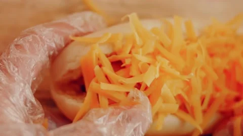 Process of preparing Irresistible chili cheese Hot Dogs. Taste USA cuisine witch Stock Footage 231548467
