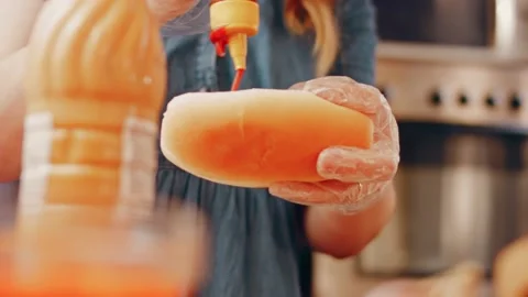 Process of preparing Irresistible chili cheese Hot Dogs. Taste USA cuisine witch Stock Footage 231548554