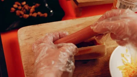 Process of preparing Irresistible chili cheese Hot Dogs. Taste USA cuisine witch Stock Footage 231548817