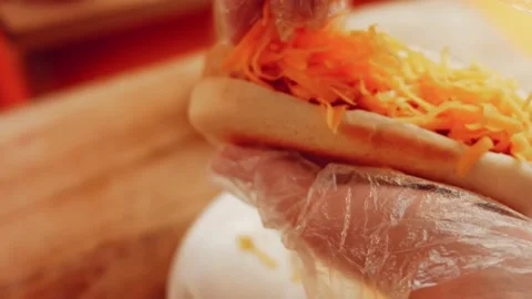 Process of preparing Irresistible chili cheese Hot Dogs. Taste USA cuisine witch Stock Footage 231548867