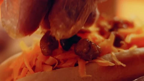 Process of preparing Irresistible chili cheese Hot Dogs. Taste USA cuisine witch Stock Footage 231548904
