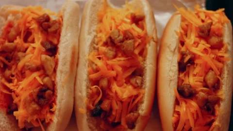 Process of preparing Irresistible chili cheese Hot Dogs. Taste USA cuisine witch Stock Footage 231548975