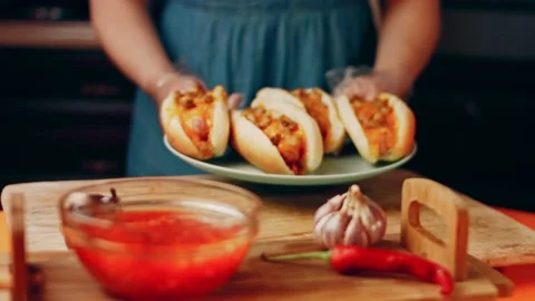 Process of preparing Irresistible chili cheese Hot Dogs. Taste USA cuisine witch Stock Footage 231549181