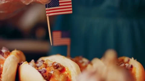 Process of preparing Irresistible chili cheese Hot Dogs. Taste USA cuisine witch Stock Footage 231549320