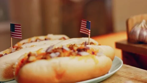 Process of preparing Irresistible chili cheese Hot Dogs. Taste USA cuisine witch Stock Footage 231549439