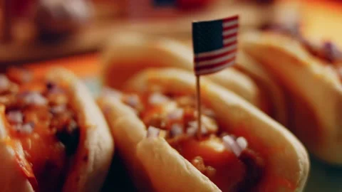 Process of preparing Irresistible chili cheese Hot Dogs. Taste USA cuisine witch Stock Footage 231549475