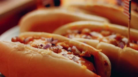 Process of preparing Irresistible chili cheese Hot Dogs. Taste USA cuisine witch Stock Footage 231549499