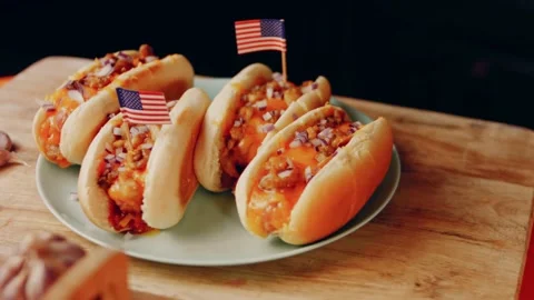 Process of preparing Irresistible chili cheese Hot Dogs. Taste USA cuisine witch Stock Footage 231549703