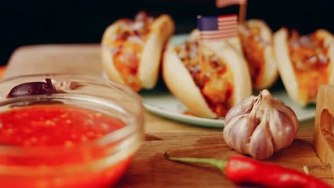 Process of preparing Irresistible chili cheese Hot Dogs. Taste USA cuisine witch Stock Footage 231549735