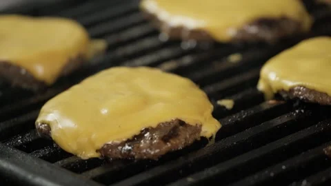 Process of preparing a meat cutlet with cheese on grill Stock Footage 153543694
